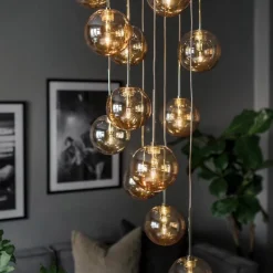 Skyfall taklampa amber/mässing